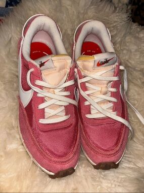 Nike coral pink and white suede low-top sneaker